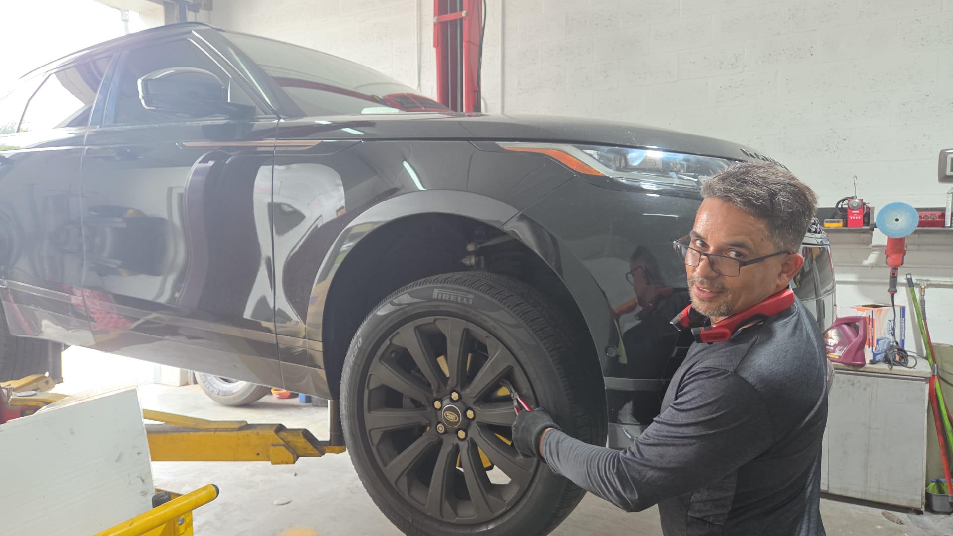 Mechanic working on Range Rover wheel